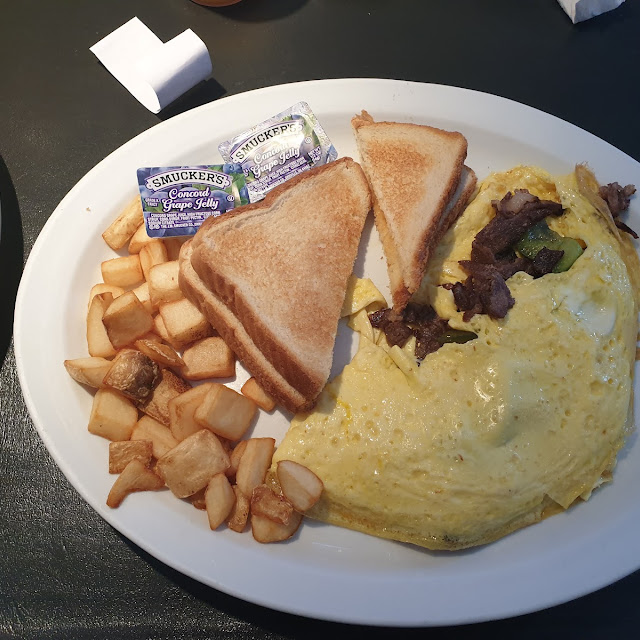 Omelet, toast, and breakfast potatoes